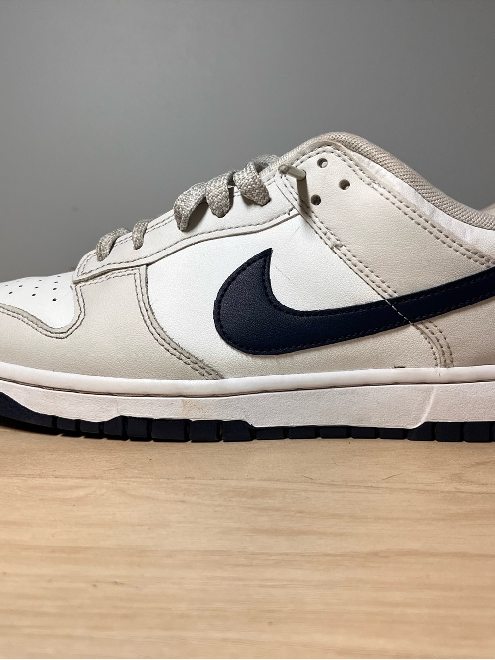 Nike Dunk Low White Cream with Black Swoosh Accent